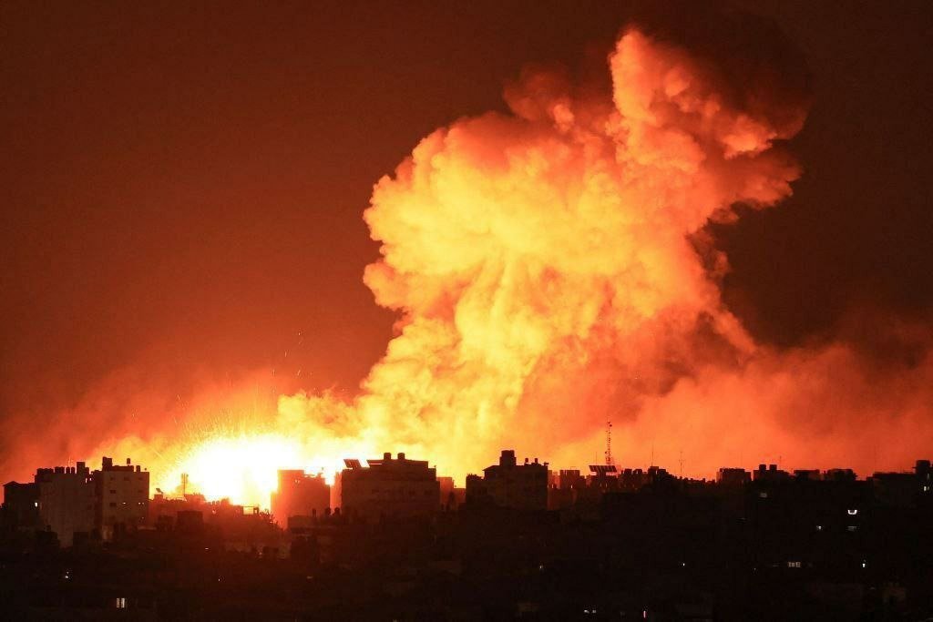 Image in @MarioNawfal's post: 🚨 JUST IN: Israeli aircraft bombed:
- The National Islamic Bank in the central Gaza Strip
- A hous…