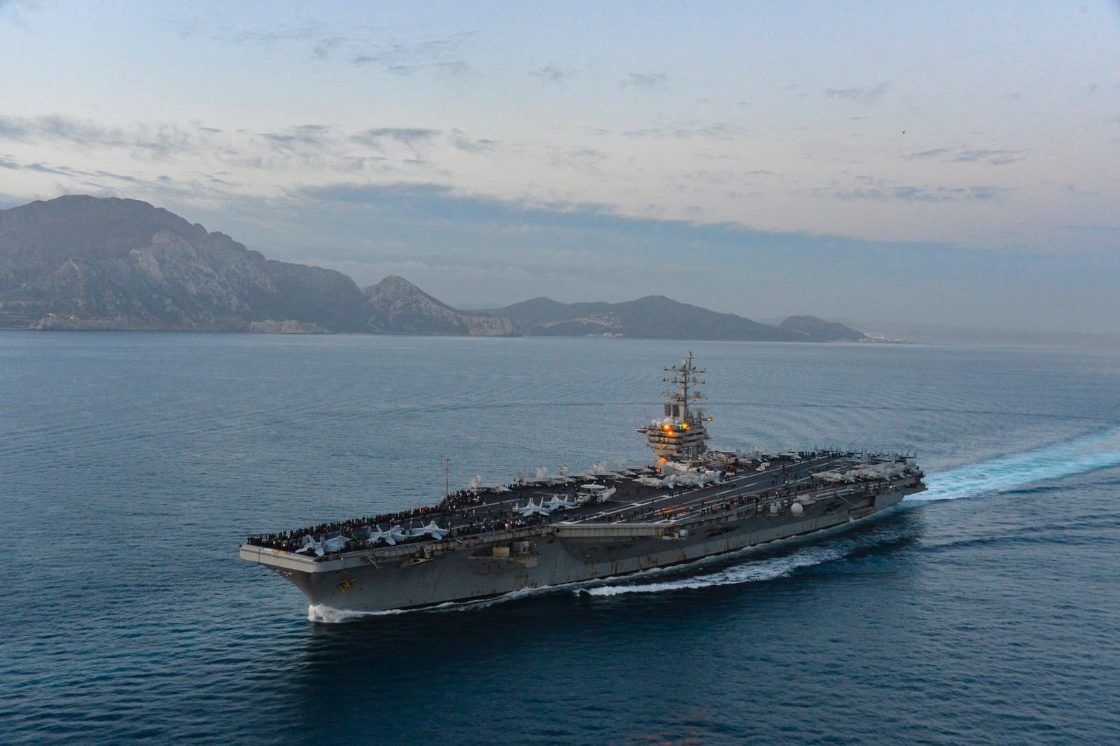Image in @MarioNawfal's post: 🚨IMAGES: The U.S Dwight D. Eisenhower Carrier Strike Group transits the Strait of Gibraltar.